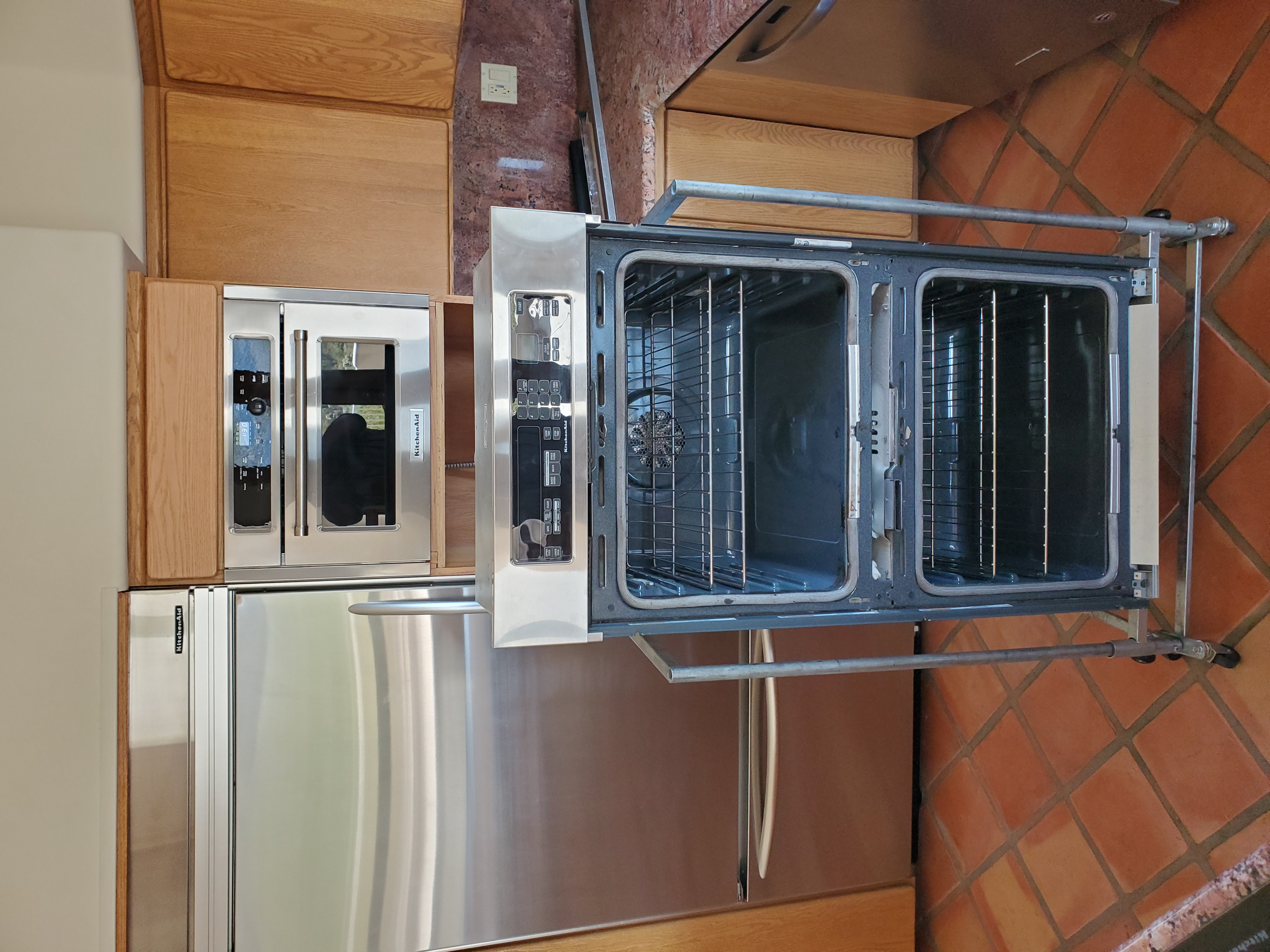Built-in wall oven service using specialty handling equipment